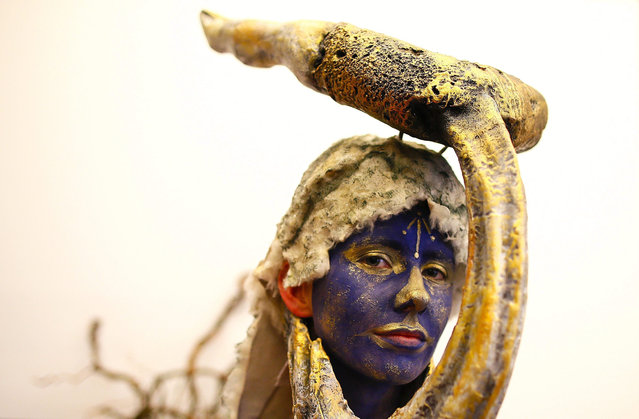 A model is painted in preparation for the Bodyspectra body painting event in Cape Town, South Africa, 23 October 2015. In its 16th year Bodyspectra is Africa's premier body painting event produced by the Cape Town based City Varsity. The annual body painting extravaganza is themed this year 'African Myths with a Twist'. (Photo by Nic Bothma/EPA)