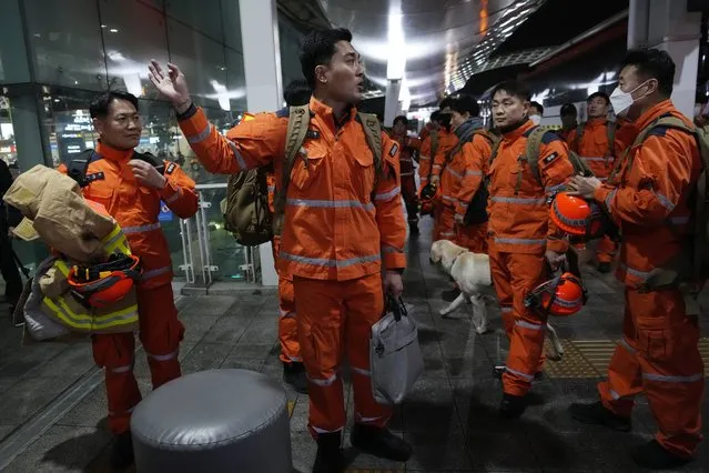 South Korean rescue team members prepare to board a plane for quake-ravaged Turkey at the Incheon International Airport in Incheon, South Korea, Tuesday, February 7, 2023. (AP Photo. (Photo by Ahn Young-joon/AP Photo)
