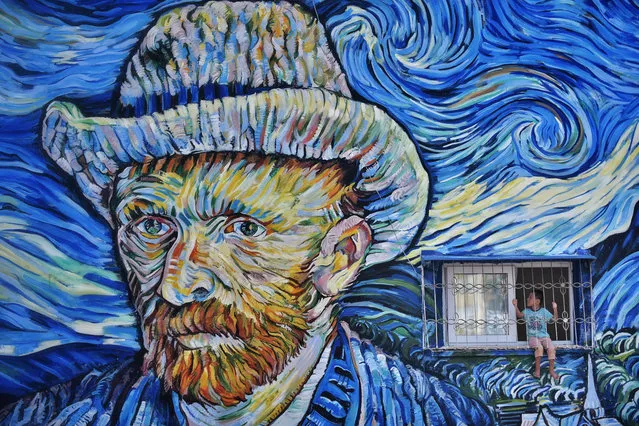 Dutch Post-Impressionist painter Vincent van Gogh's “The Starry Night” reproduced on a wall of a building by Turkish painter Nazife Bilgin Hazar is seen in Mersin, Turkey on September 16, 2020. (Photo by Serkan Avci/Anadolu Agency via Getty Images)