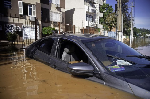 Water is seen inside a car in the flooded streets in Menino Deus Neighborhood, on May 6, 2024 in Porto Alegre, Brazil. Rescue efforts continue in Porto Alegre due to the floods caused by the heavy rains that have battered Brazilian State of Rio Grande Do Sul. A State of Public Calamity has been called by local government while 281 municipalities have been affected, thousands of people have been displaced and damages in infrastructure cause difficulties to access affected areas or big power outages around the state. (Photo by Max Peixoto/Getty Images)