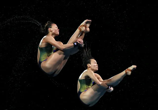 Jun Hoong Cheong and Pandelela Rinong Pamg of Malaysia compete in the Women's Synchronised 10m Platform Diving Final on day seven of the Gold Coast 2018 Commonwealth Games at Optus Aquatic Centre on April 11, 2018 on the Gold Coast, Australia. (Photo by Athit Perawongmetha/Reuters)