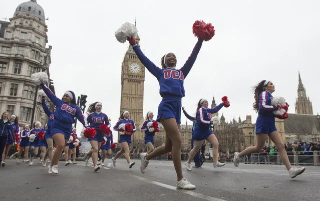 Members of the U.S. Universal Cheerleaders Association wave their pom-poms at the finish of the annual New Year's Day parade in London January 1, 2015. (Photo by Peter Nicholls/Reuters)
