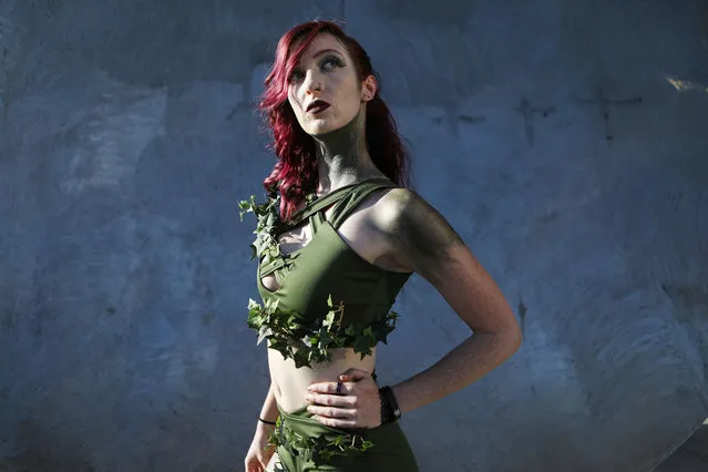 A cosplayer dressed as Poison Ivy poses outside San Diego Comic-Con on July 19, 2018 in San Diego, California. Thousands of revelers are arriving for the festivities at the annual comic and entertainment convention. (Photo by Mario Tama/Getty Images)