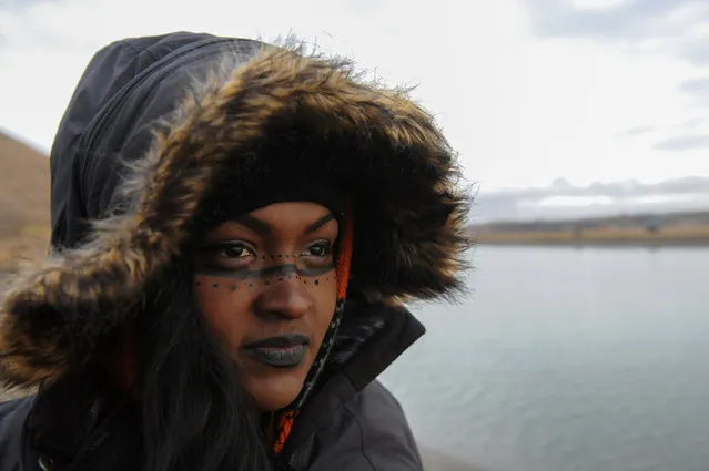 Chenae Bullock from the Shinnecock tribe poses for a photograph during a protest against plans to pass the Dakota Access pipeline near the Standing Rock Indian Reservation, near Cannon Ball, North Dakota, U.S. November 24, 2016. (Photo by Stephanie Keith/Reuters)