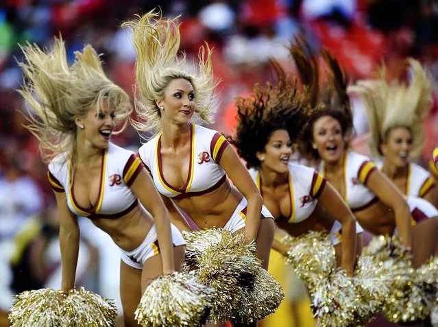 Washington Redskins cheerleaders perform during a preseason game against the Buffalo Bills in Landover, Md. (Photo by Nick Wass/Associated Press)
