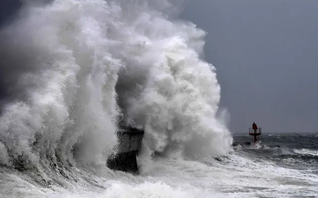 This photograph taken in Plobannalec-Lesconil, western France, on March 9, 2023 shows a high wave hitting the coast. (Photo by Fred Tanneau/AFP Photo)