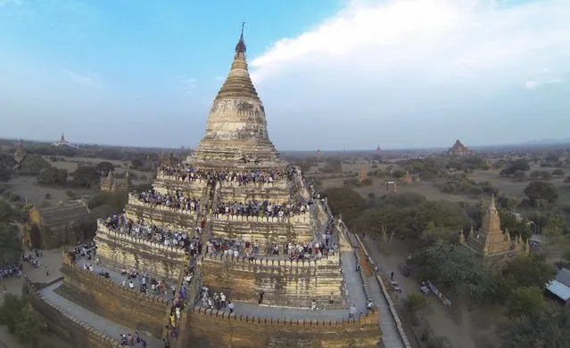 People wait to see the sunset from the top of Shwesandaw Pagoda in the ancient city of Bagan February 13, 2015. (Photo by Soe Zeya Tun/Reuters)