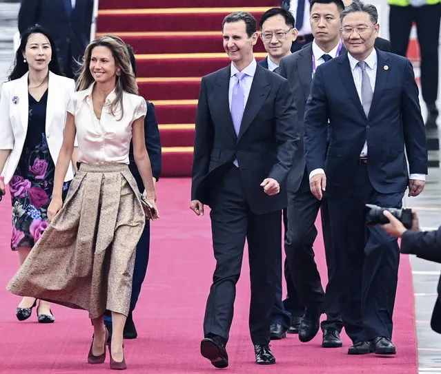 Syrian President Bashar al-Assad (4-R) and his spouse Asma al-Assad (2-L) arrive in Hangzhou, China, 21 September 2023. Al-Assad arrived on 21 Sepotember in China to attend the opening ceremony of the 19th Asian Games. (Photo by Xu Yu/Xinhua News Agency via EPA)