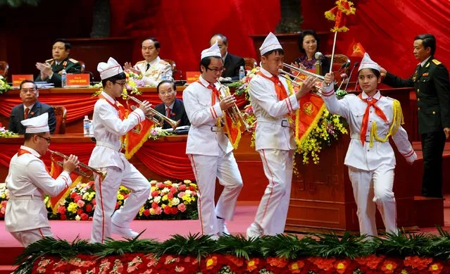 Communist Pioneers' league members play music to welcome delegates during the official opening ceremony of Vietnam's Communist Party's 12th National Congress being held in Hanoi  January 21, 2016. (Photo by Hoang Dinh Nam/Reuters)