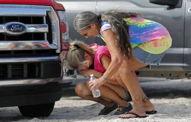 Nancy Register weeps as she is comforted by Roxie Cline, right, after she lost her home and all the contents inside to Hurricane Michael in Mexico Beach, Fla., Wednesday, October 17, 2018. Register said she doesn't know how she and her husband will make it through this, saying they only have money to last them four more days. (Photo by Gerald Herbert/AP Photo)