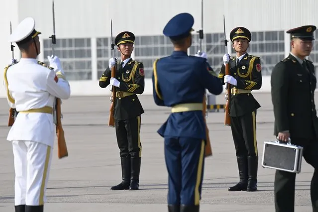 Chinese honor guards prepare for the arrival of Russia's President Vladimir Putin ahead of the third Belt and Road Forum, at Beijing Capital International Airport in Beijing, Tuesday, October 17, 2023. (Photo by Parker Song/Pool Photo via AP Photo)
