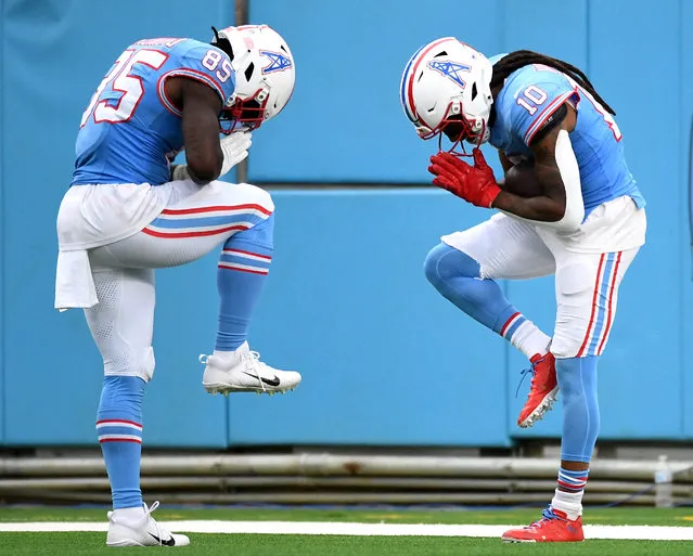 Tennessee Titans wide receiver DeAndre Hopkins (10) and tight end Chigoziem Okonkwo (85) celebrate after a touchdown during the second half against the Atlanta Falcons at Nissan Stadium in Nashville, Tennessee on October 29, 2023. (Photo by Christopher Hanewinckel/USA TODAY Sports)