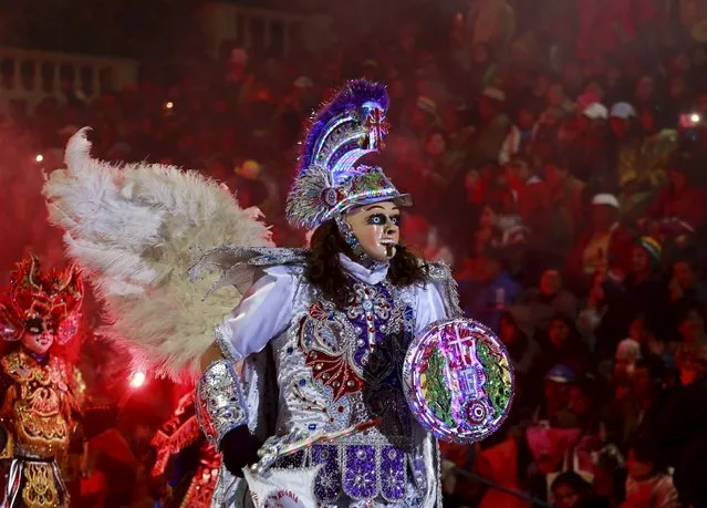 An angel, a character of Diablada Ferroviaria group performs during the carnival parade in  Oruro, south of La Paz, February 6, 2016. (Photo by David Mercado/Reuters)