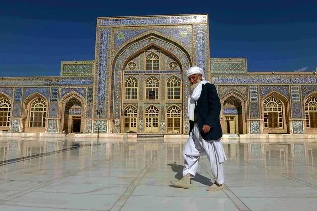 A man walks in front of the 800-year-old Great Mosque in Herat, Afghanistan, on December 10, 2018. (Photo by Radio Free Europe/Radio Liberty)