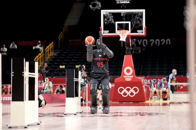 A robot shoots baskets during halftime of the Men's Preliminary Round Group A game between the United States and Iran on day five of the Tokyo 2020 Olympic Games at Saitama Super Arena on July 28, 2021 in Saitama, Japan. (Photo by Gregory Shamus/Getty Images)