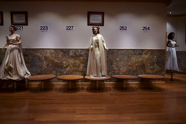 Wax figures of first ladies Jackie Kennedy (C) and Michelle Obama (R) are displayed at the Hall of Presidents Museum, which closed in November, during an auction in Gettysburg, Pennsylvania, U.S. January 14, 2017. (Photo by Mark Makela/Reuters)