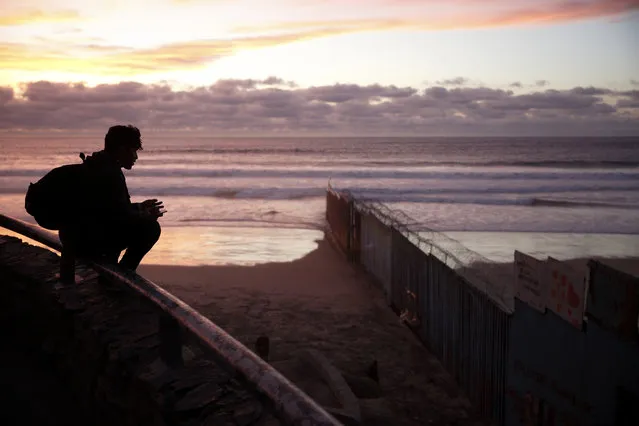 In this Wednesday, January 9, 2019, file photo a man looks towards where the border wall meets the Pacific Ocean in Tijuana, Mexico. With the standoff over paying for his long-promised border wall dragging on, the president’s Oval Office address and visit to the Texas border over the past week failed to break the logjam and left aides and allies fearful that the president has misjudged Democratic resolve and is running out of negotiating options. (Photo by Gregory Bull/AP Photo)