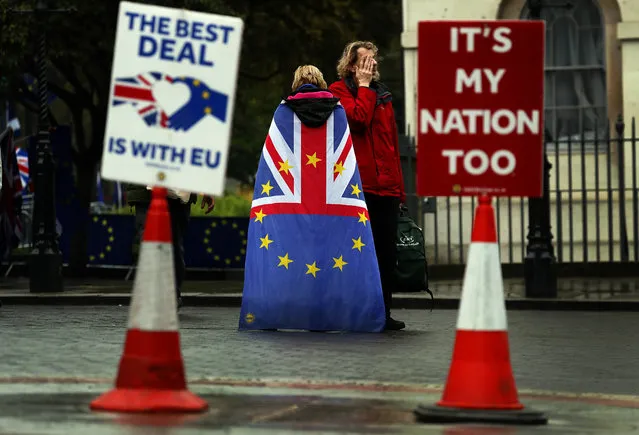 Pro EU protestors demonstrate opposite the Houses of Parliament in London, Monday, April 8, 2019. Britain's Prime Minister Theresa May will hold talks with the leaders of Germany and France ahead of a key Brexit summit later this week. (Photo by Frank Augstein/AP Photo)