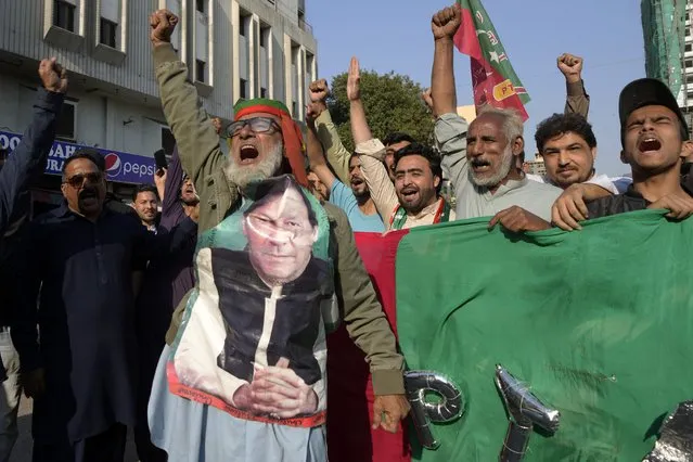 Supporters of Pakistan's Former Prime Minister Imran Khan's party 'Pakistan Tehreek-e-Insaf' chant slogans during a protest against alleged vote-rigging in some constituencies in the parliamentary elections, in Karachi, Pakistan, Sunday, February 11, 2024. (Photo by Fareed Khan/AP Photo)