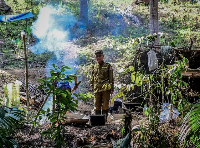 Jaime “Ka Diego” Padilla, spokesperson of the Melito Glor Command of the New People's Army (NPA) stands in a rebel camp at an undisclosed location in the mountains of Sierra Madre, Philippines, 31 March 2019. Last year, more than 380 government security personnel were killed in rebel attacks, the NPA said. However, security officials have downplayed the rebel threats as propaganda from a spent force of criminals and terrorists. (Photo by Alecs Ongcal/EPA/EFE)