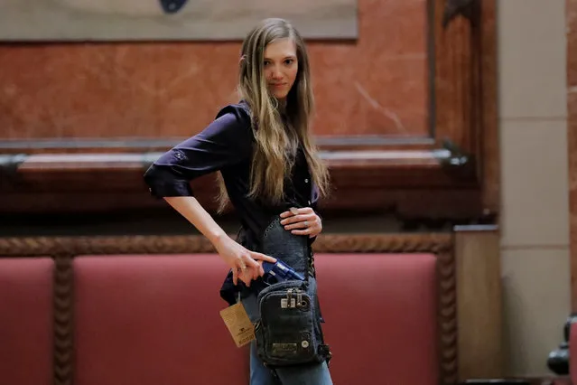 A woman models a Sportsman bag by Ukoalabag during the “Fashion & Firearms” concealed carry fashion show at the National Rifle Association (NRA) annual meeting in Indianapolis, Indiana, U.S., April 27, 2019. (Photo by Lucas Jackson/Reuters)
