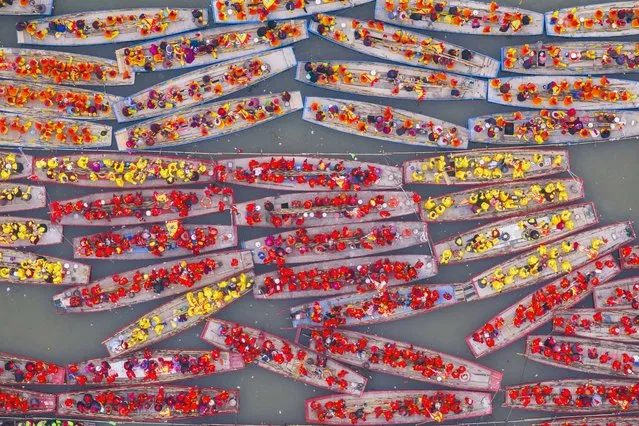 An aerial view shows participants on their traditional boats during the Taizhou Jiangyan Qintong Boat Festival at the Qinhu National Wetland Park in Taizhou, in eastern China's Jiangsu province on April 6, 2024. (Photo by AFP Photo/China Stringer Network)