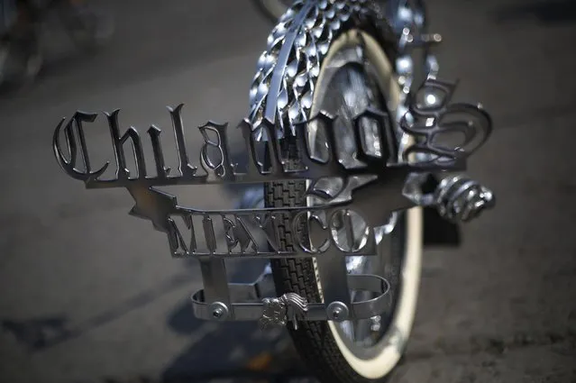 The wheel of a bicycle that reads "Chilango, Mexico" is seen during a  meet of cyclists to form a shape of a bicycle with the aim of promoting cycling as a mode of transport and to commemorate Bicycle Day, which is celebrated April 19 annually, at Zocalo square in Mexico City, Mexico, April 10, 2016. (Photo by Edgard Garrido/Reuters)