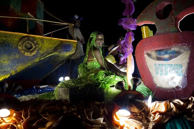 A Carnival queen sits on a float during the Carnival parade in Les Cayes, Haiti, Tuesday, February 28, 2017. While Carnival is traditionally a time of all-night bashes and escape from the worries of daily life, last year's Hurricane Matthew has put a damper on the celebrations for some in southwest Haiti. (Photo by Dieu Nalio Chery/AP Photo)