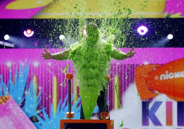 Show host John Cena  gets slimed onstage at Nickelodeon's 2017 Kids' Choice Awards at USC Galen Center on March 11, 2017 in Los Angeles, California. (Photo by Mario Anzuoni/Reuters)