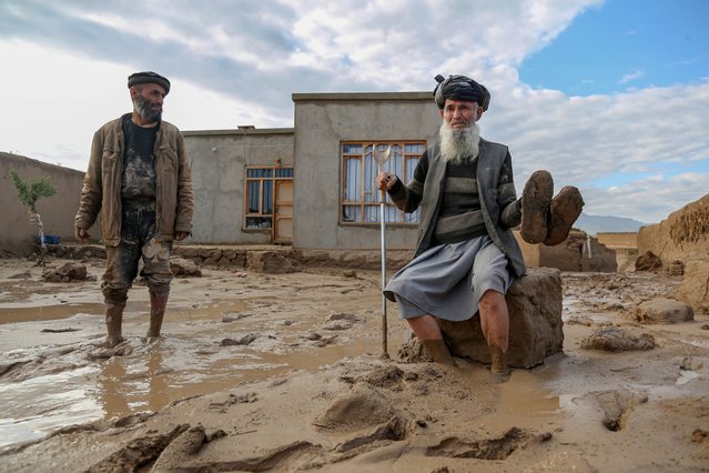 People survey their damaged houses after flash floods in Shahrak Muhajireen village in Baghlan, Afghanistan, 12 May 2024. At least 300 people have died amid heavy floods in Baghlan province in northern Afghanistan, the United Nations Food Program (WFP) said on 11 May. The Asian country is one of the world's most vulnerable to climate change and the least prepared to adapt, according to a report by the United Nations Office for the Coordination of Humanitarian Affairs (OCHA). Much of the country's international aid and funding were frozen after the Taliban seized power in August 2021. (Photo by Samiullah Popal/EPA/EFE)