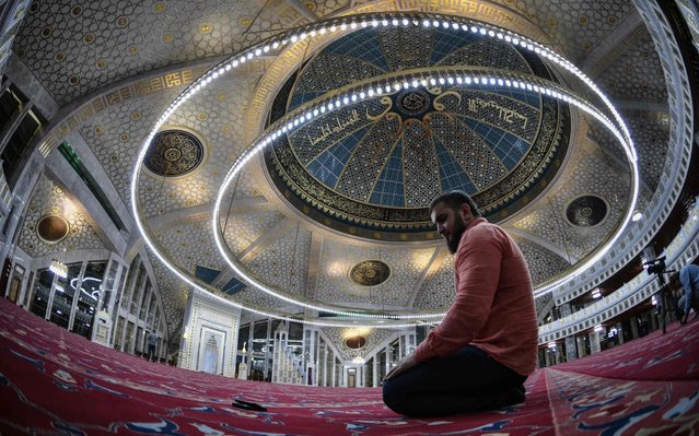 A man prays in a mosque in the Chechen town of Argun on July 24, 2019. (Photo by Alexander Nemenov/AFP Photo)