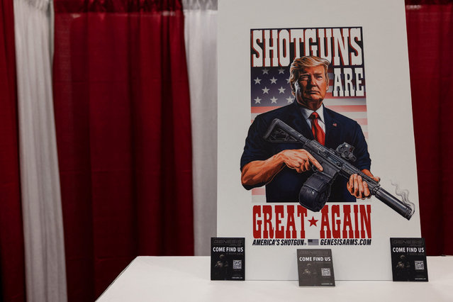 A poster depicting Republican presidential candidate and former U.S. President Donald Trump is displayed at an exhibition booth during the National Rifle Association (NRA) annual convention in Dallas, Texas, U.S., May 18, 2024. (Photo by Carlos Barria/Reuters)