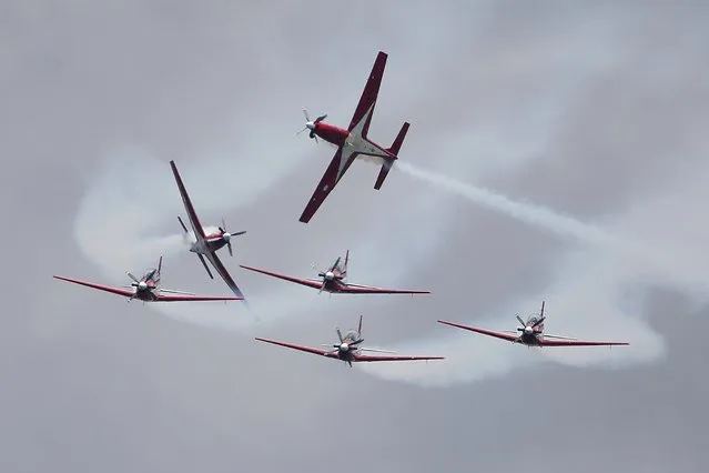 Indonesian Air Force's Jupiter Aerobatic Team takes part in an aerial display during the Singapore Airshow 2022 at Changi Exhibition Centre in Singapore, Tuesday, February 15, 2022. (Photo by Suhaimi Abdullah/AP Photo)