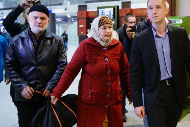The parents of Akbarjon Djalilov, who has been identified by Russia's investigators as the bomber in the Saint Petersburg metro blast, walk at Pulkovo airport upon their arrival to Saint Petersburg from Osh, Kyrgyzstan, early on April 5, 2017. (Photo by Olga Maltseva/AFP Photo)