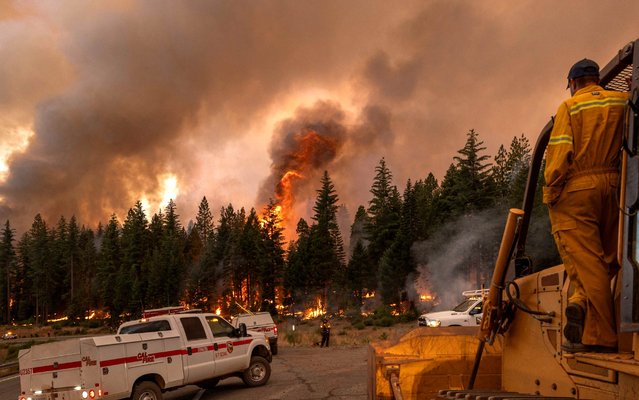 Firefighters work to battle the eastern front of the Park Fire near Chico, California, on July 28, 2024. (Photo by Yonhap News/AFP Photo)