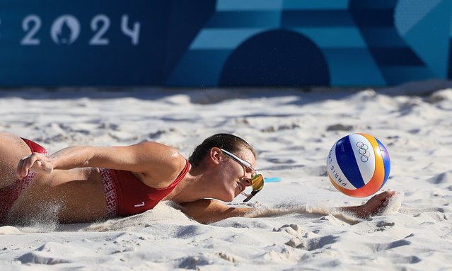 Tina Graudina’s glasses fall from her head as she fails to reach the ball during Latvia’s women’s round of 16 beach volleyball match against Germany on August 5, 2024. (Photo by Esa Alexander/Reuters)