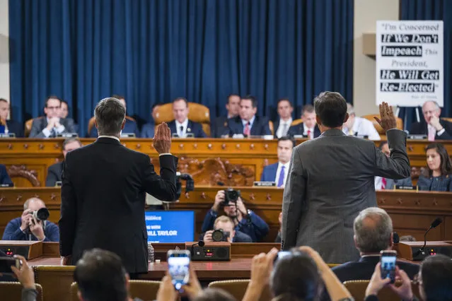 Top U.S. diplomat in Ukraine William Taylor, left, and Career Foreign Service officer George Kent are sworn in prior to testifying before the House Intelligence Committee on Capitol Hill in Washington, Wednesday, November 13, 2019, during the first public impeachment hearing of President Donald Trump's efforts to tie U.S. aid for Ukraine to investigations of his political opponents. (Photo by Jim Lo Scalzo/Pool Photo via AP Photo)