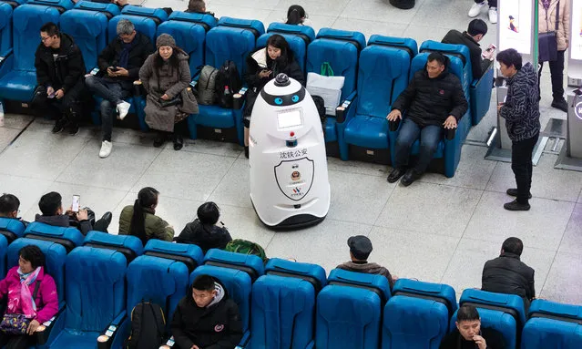 A police robot patrols at Changchun Railway Station on December 2, 2019 in Changchun, Jilin Province of China. The police robot can patrol, monitor and also can recognize passengers' faces to compare with the faces of the escaped criminals. (Photo by VCG/VCG via Getty Images)