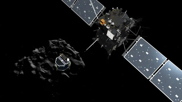 This handout file photo taken on November 10, 2014  and released on November 12, 2014 by the ESA/ATG medialab shows an artists impression of the European probe Philae separating from its mother ship Rosetta and descending to the surface of comet 67P/Churyumov-Gerasimenko. Europe lost contact over the weekend of May 28 with Rosetta, 5 km from the surface of Comet 67P/Churyumov-Gerasimenko. Contact with the spacecraft has since been recovered, the European Space Agency (ESA) announced on June 2, 2016. (Photo by AFP Photo/ESA)