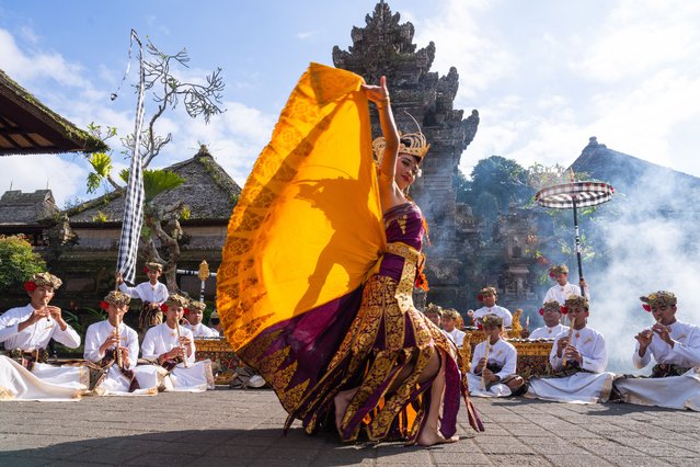 Traditional dancers are performing for the visitors at Penglipuran village in Bali, Indonesia, on August 15, 2024. “Penglipuran Village (Penglipuran Tourism Village) is a tourist attraction of culture, traditions, and architectural buildings that have been preserved for generations. Our village is receiving an award as one of the cleanest villages in the world. It has a Heroes Monument, a forest area, and a bamboo forest area. Don't hesitate to visit this clean and environmentally friendly village. The Official Penglipuran Tourism Village Account belongs to the Penglipuran Traditional Village”. (Photo by Thilina Kaluthotage/NurPhoto/Rex Features/Shutterstock)