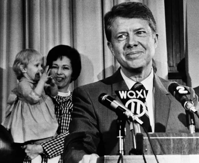 Former State Sen. Jimmy Carter listens to applause at the Capitol in Atlanta on April 3, 1970, after announcing his candidacy or governor.  In background, his wife Rosalyn holds two-year-old daughter Amy who joined in the applause. Carter, 45, of Plains, Ga., finished third in the 1966 Democratic Primary behind Gov. Lester Maddox and Ellis Arnall. (Photo by Charles Kelly/AP Photo)