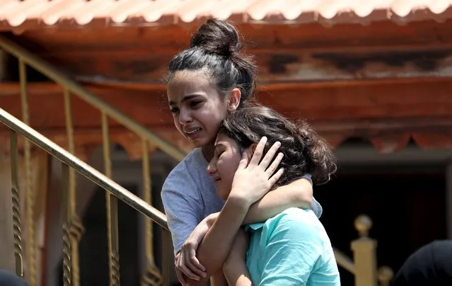 Relatives of Palestinian youth Laith al-Khaldi mourn during his funeral near the West Bank city of Ramallah August 1, 2015. Al-Khaldi died on Saturday at a West Bank hospital following a clash with Israeli troops near Ramallah, Palestinian hospital officials said. (Photo by Mohamad Torokman/Reuters)