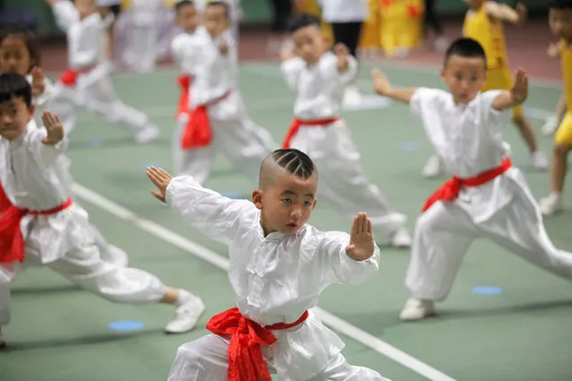 Children take part in a children's martial arts competition in Xi'an, Shaanxi province, China June 18, 2017. (Photo by Reuters/Stringer)