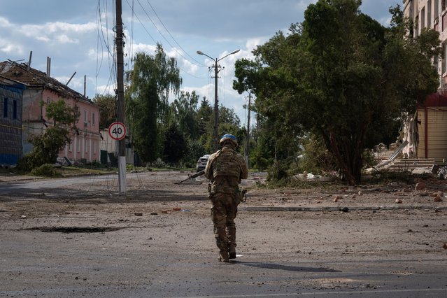 A Ukrainian soldier walks in the city centre of Sudzha in Russia’s Kursk region on August 16, 2024. Volodymyr Zelenskiy said Ukraine’s military incursion into Kursk aims to create a buffer zone to prevent further attacks by Moscow across the border. (Photo by AP Photo)