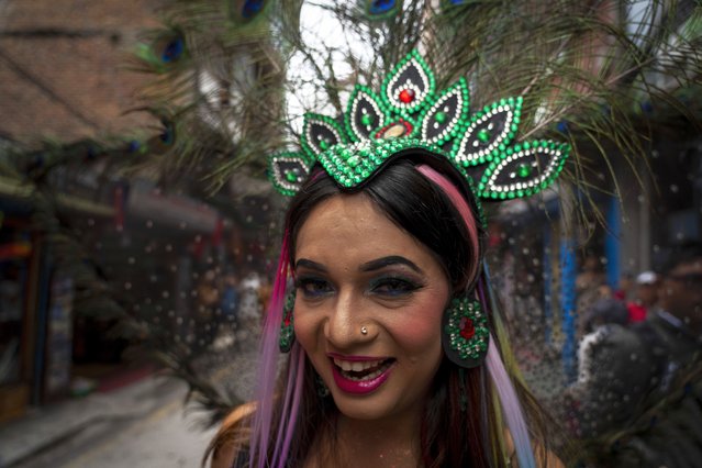 A participants dances as LGBTQ+ people and their supporters rally during the annual pride parade, in Kathmandu, Nepal, Tuesday, August 20, 2024. (Photo by Niranjan Shrestha/AP Photo)