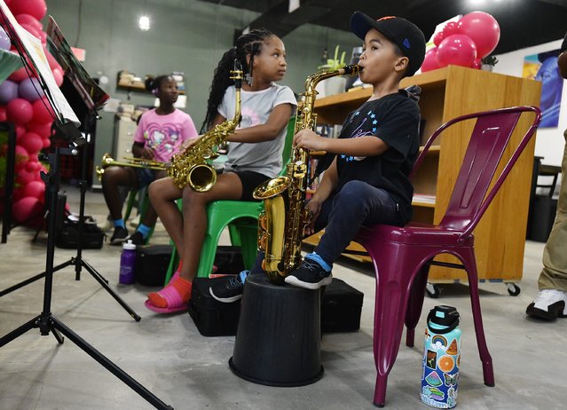 Zion Turck, 7 works on his saxophone technique during free music classes offered by Moses Evans, the band director at Highlands Middle School Wednesday, September 4, 2024 at Cafe Resistance in Jacksonville, Florida. Angie Nixon has opened Cafe Resistance, a community space on Soutel Drive for members of Jacksonville's African-American community to gather for community meetings, have a cup of coffee, bring children to read, and also offers free music lessons for children. (Photo by Bob Self/Florida Times-Union via USA TODAY Network)