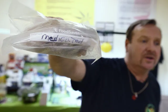 In this Thursday, July 10, 2014, photo, Mike Fitzgerald holds a storage bag of cannabis-infused cookies marked “medicated” during a cooking class at the New England Grass Roots Institute in Quincy, Mass. Users of pot edibles, such as cookies, are often advised to eat only a portion so they don't get too high. Education about proper dosing has become a priority after at least one death and a handful of hospital visits were linked to consuming too much of an edible. (Photo by Michael Dwyer/AP Photo)