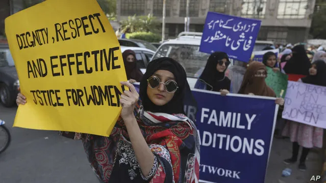 Pakistanis take party in a pro-women rally ahead of Women's Day in Karachi, Pakistan, Friday, March 6, 2020. Pakistani women plan to hold rallies across the country to celebrate International Women's Day to bring attention to their efforts to seek better jobs, protections in the work place and end domestic violence. (Photo by Fareed Khan/AP Photo)