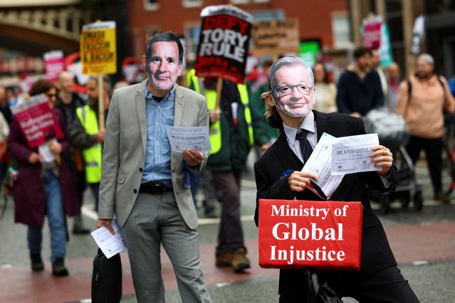 Demonstrators dressed up as Minister for Levelling Up, Housing and Communities, Michael Gove and Chancellor of the Exchequer Jeremy Hunt take part in an anti-government protest as Britain's Conservative Party's annual conference takes place in Manchester, Britain on October 1, 2023. (Photo by Hannah McKay/Reuters)