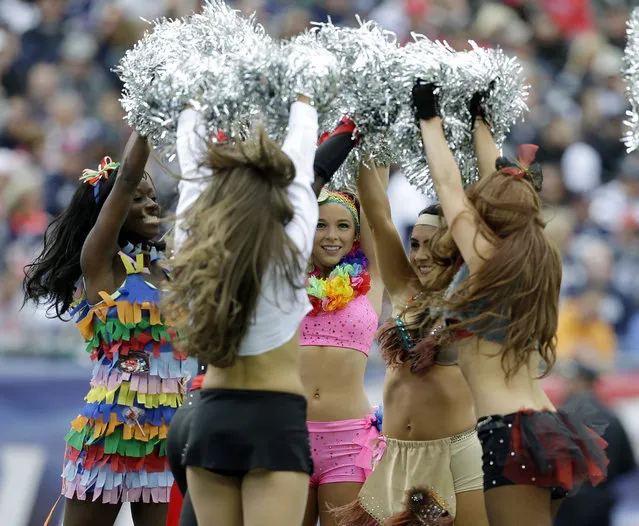 New England Patriots cheerleaders, dressed in Halloween costumes, perform in the second quarter of an NFL football game against the Miami Dolphins Sunday, October 27, 2013, in Foxborough, Mass. (Photo by Steven Senne/AP Photo)
